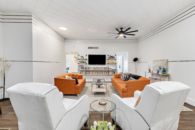 living room with ceiling fan, dark hardwood / wood-style floors, and ornamental molding