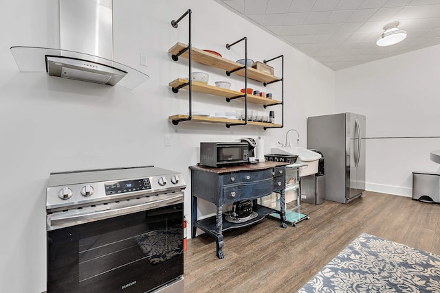 office featuring sink, a paneled ceiling, and hardwood / wood-style flooring