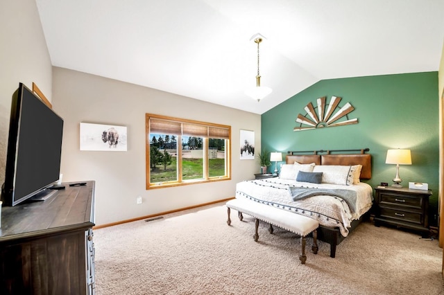 carpeted bedroom featuring lofted ceiling, visible vents, and baseboards