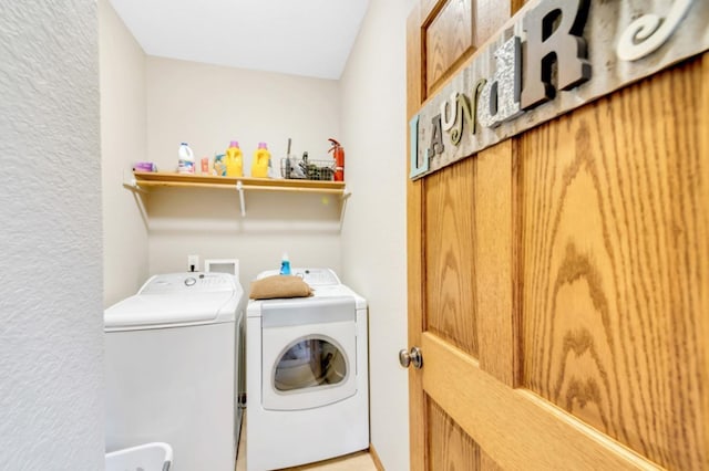 clothes washing area featuring laundry area and independent washer and dryer