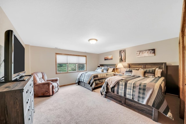 bedroom with carpet flooring and baseboards