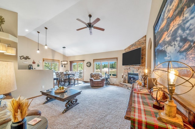 living room featuring carpet floors, high vaulted ceiling, plenty of natural light, and a fireplace