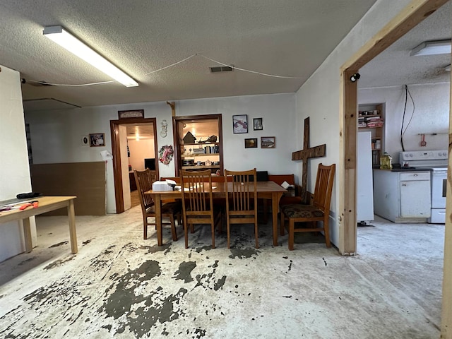 dining room with a textured ceiling