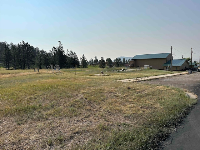 view of yard with a rural view