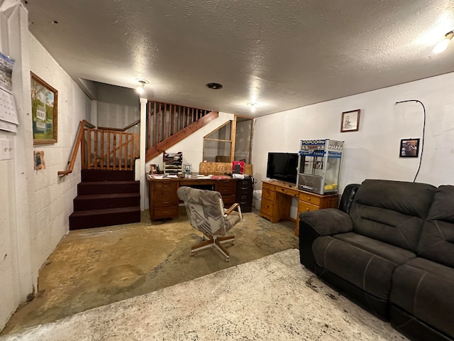 living room with a textured ceiling