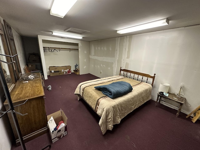 bedroom with attic access and a closet