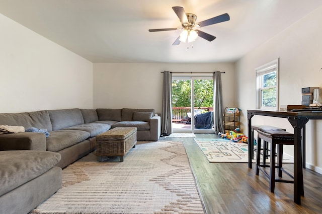 living room with ceiling fan and hardwood / wood-style floors