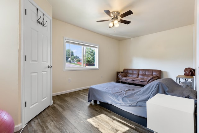 bedroom with ceiling fan and hardwood / wood-style flooring