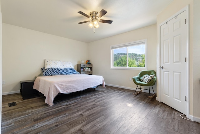 bedroom with hardwood / wood-style flooring and ceiling fan