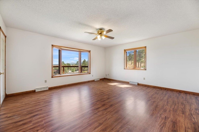 spare room featuring a textured ceiling, ceiling fan, and hardwood / wood-style flooring