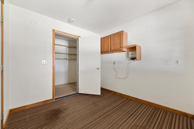 unfurnished bedroom featuring a closet and carpet