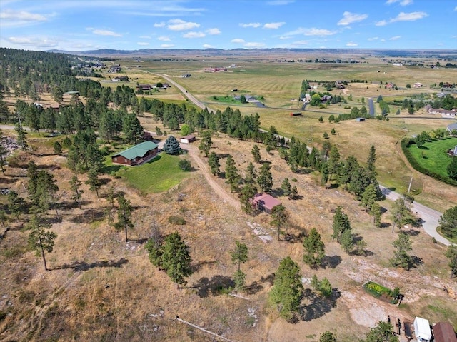 birds eye view of property with a rural view