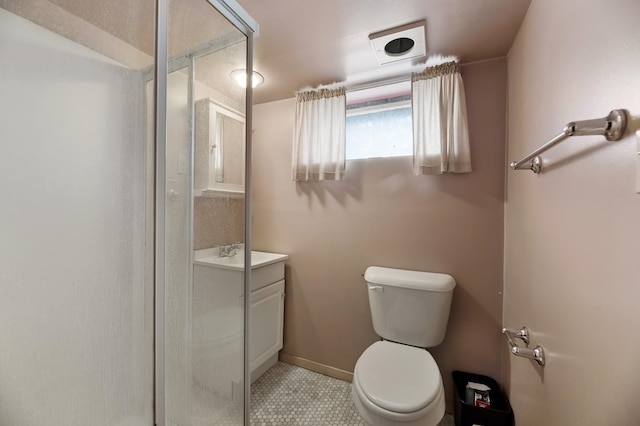 bathroom with tile patterned flooring, vanity, toilet, and an enclosed shower