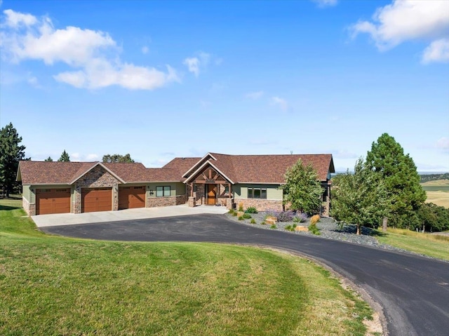 view of front facade with a garage and a front lawn