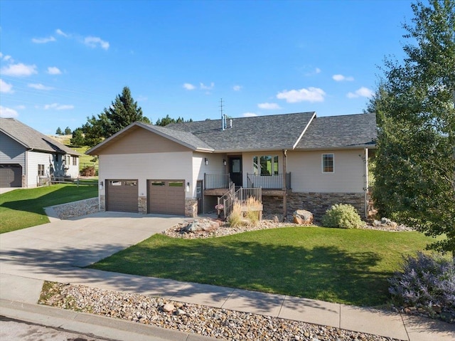 view of front facade with a garage, covered porch, and a front lawn