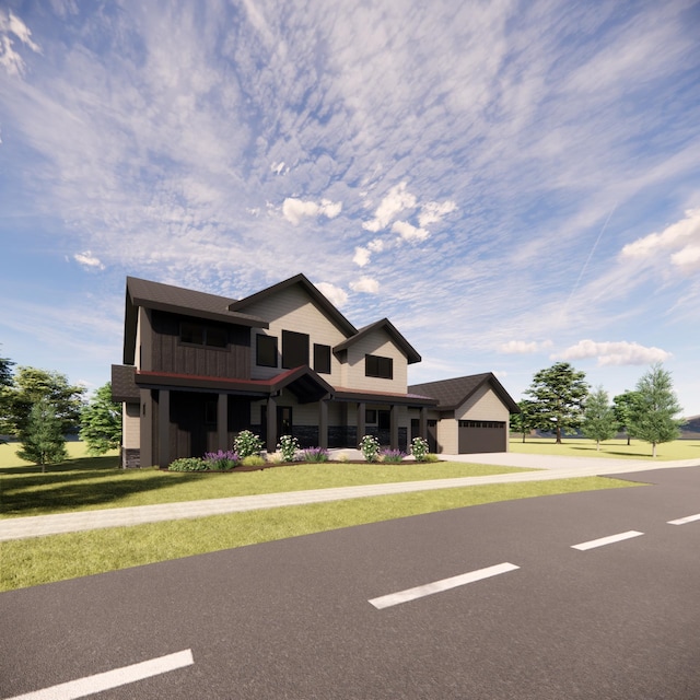 view of front of house with a garage and a front yard