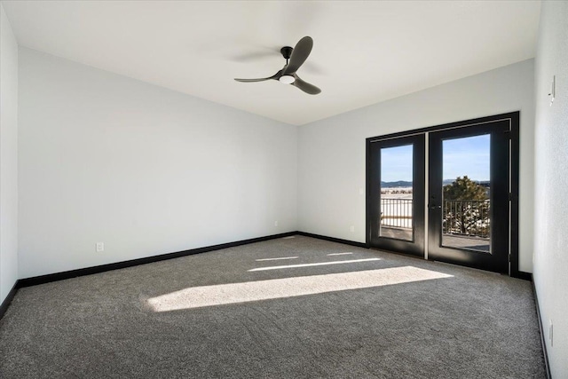 spare room with carpet floors, french doors, and ceiling fan