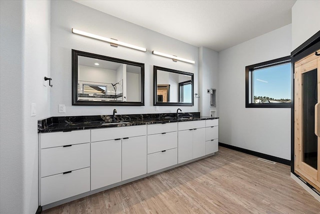 bathroom with vanity and wood-type flooring