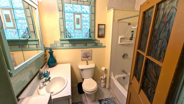 full bathroom with a wealth of natural light, vanity, toilet, and bathing tub / shower combination