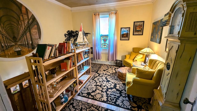 sitting room featuring crown molding