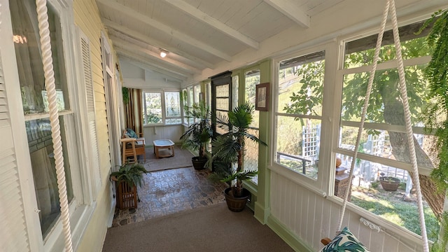 unfurnished sunroom with wooden ceiling and vaulted ceiling with beams