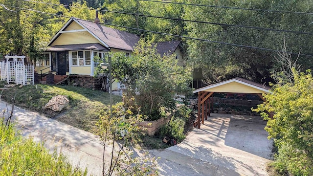 view of front of property featuring a carport