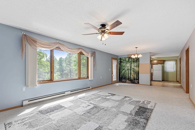 carpeted spare room featuring a baseboard radiator, baseboards, and a textured ceiling