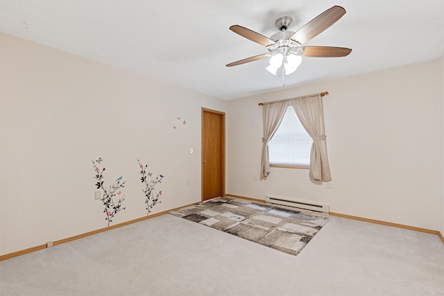 carpeted empty room with baseboards, baseboard heating, and a ceiling fan