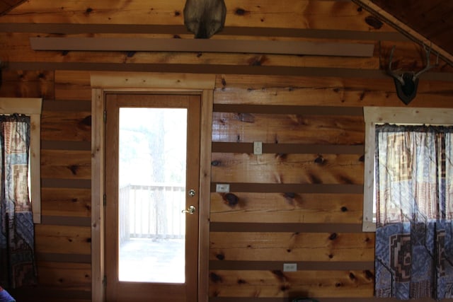 doorway to outside featuring plenty of natural light