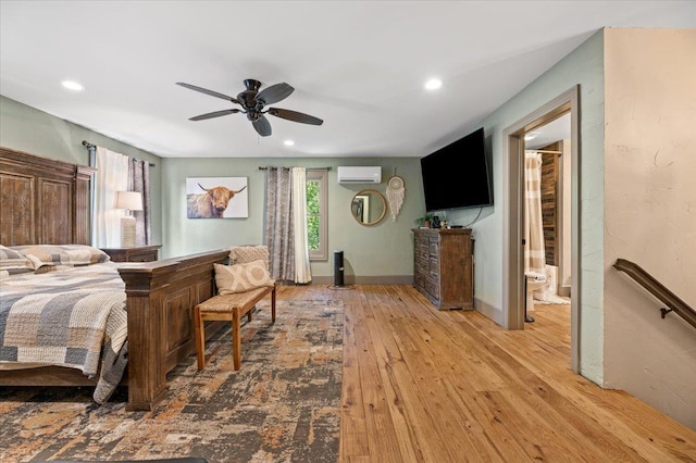 bedroom featuring ceiling fan, recessed lighting, baseboards, a wall mounted AC, and wood-type flooring