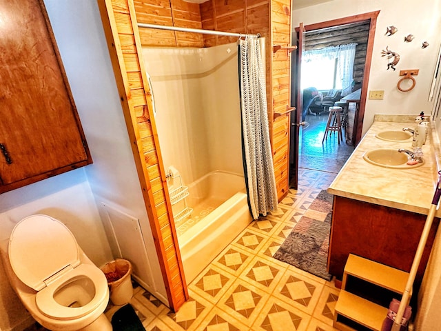 full bathroom with vanity, toilet, and shower / bath combination with curtain