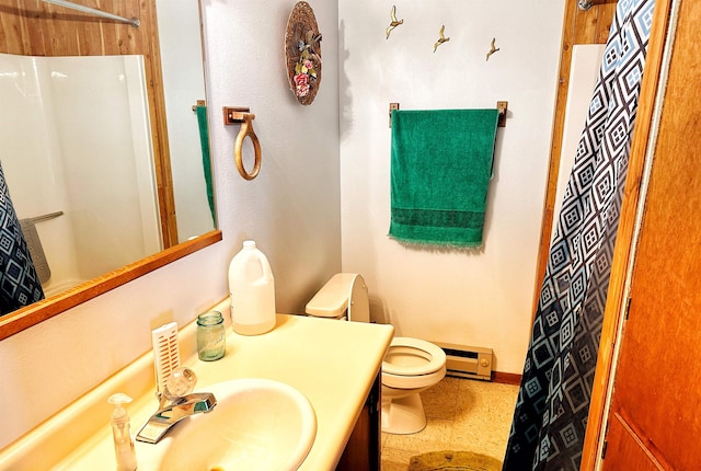 bathroom featuring vanity, toilet, a shower with curtain, and a baseboard radiator