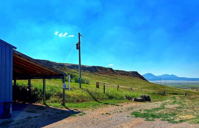 view of mountain feature with a rural view