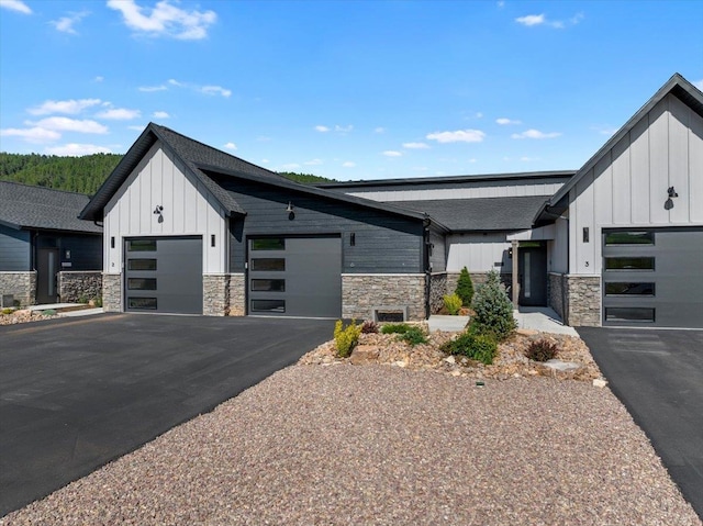 modern inspired farmhouse featuring a garage