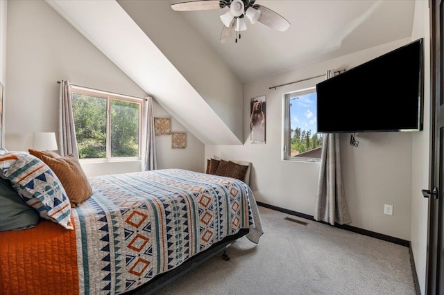21185 Lost Camp Trl, Lead, SD 57754 - carpeted bedroom with baseboards, lofted ceiling, ceiling fan, and visible vents