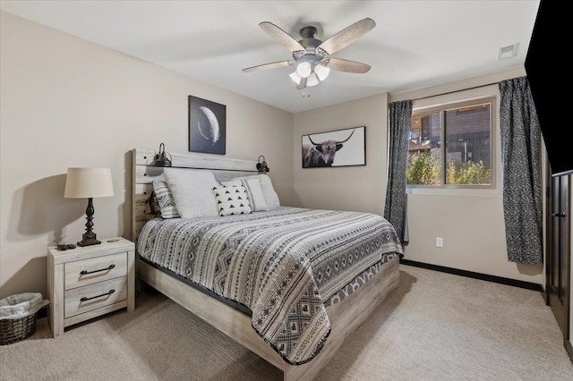 carpeted bedroom with ceiling fan