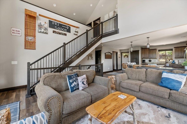 21185 Lost Camp Trl, Lead, SD 57754 - living room with baseboards, high vaulted ceiling, and wood finished floors