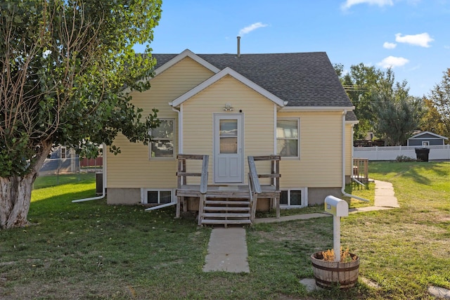 2334 S Davenport St, Sturgis, SD 57785 - bungalow with a shingled roof, fence, and a front lawn