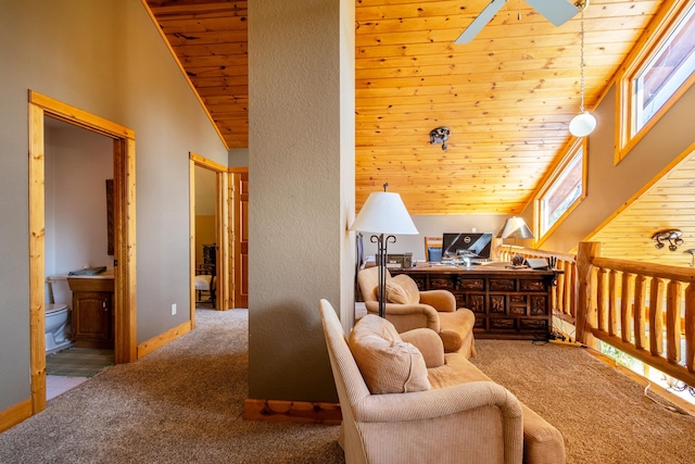 sitting room featuring wood ceiling, carpet flooring, high vaulted ceiling, a skylight, and ceiling fan