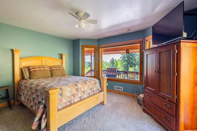 bedroom featuring baseboards, light carpet, a textured ceiling, visible vents, and ceiling fan