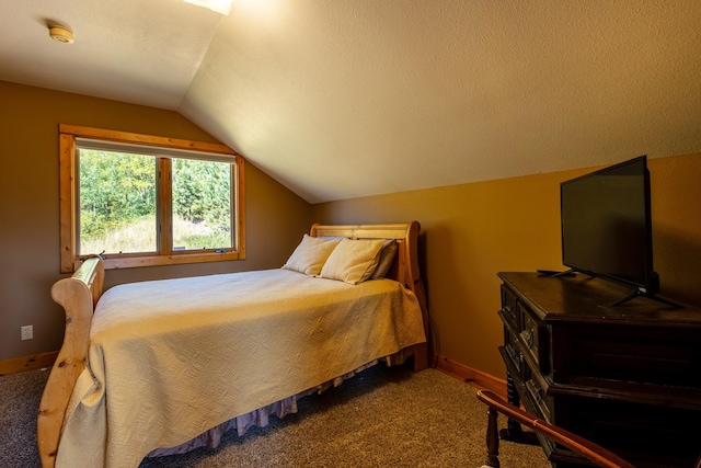 carpeted bedroom with a textured ceiling and lofted ceiling