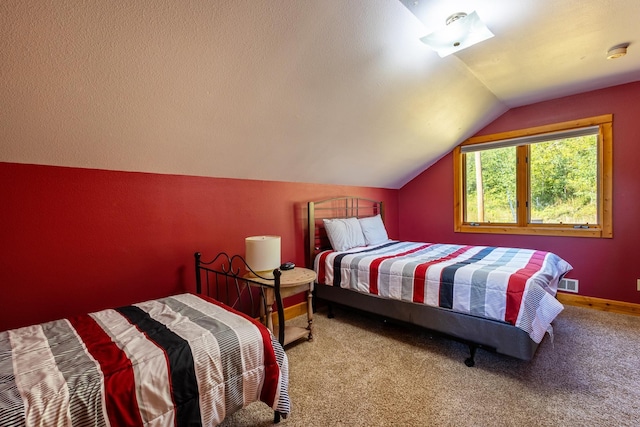 carpeted bedroom featuring a textured ceiling, baseboards, lofted ceiling, and visible vents