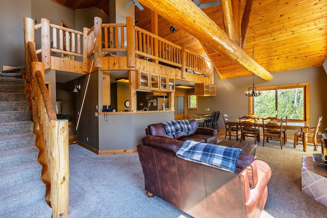 living area featuring beam ceiling, baseboards, wooden ceiling, and carpet floors