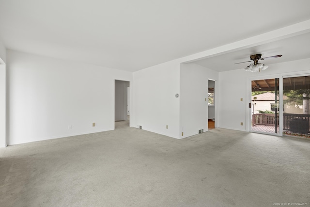 interior space with carpet and ceiling fan