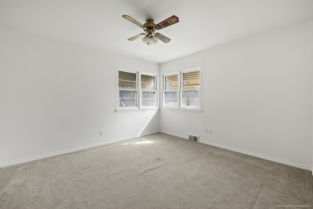 carpeted empty room with ceiling fan