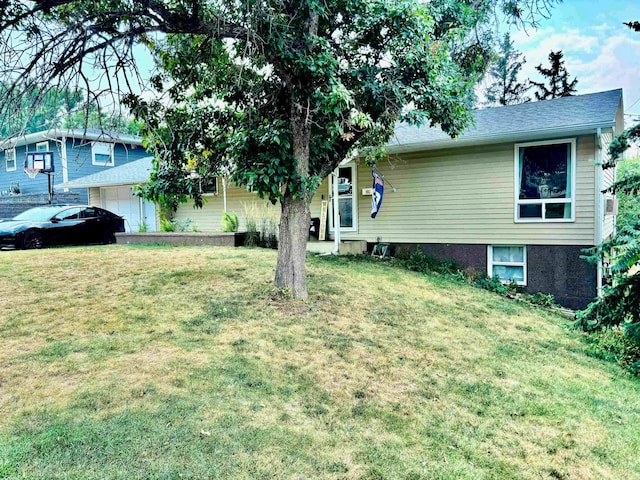 exterior space with a lawn and a garage