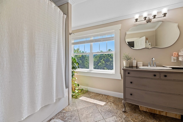 bathroom with tile patterned floors, ornamental molding, shower / tub combo, and vanity