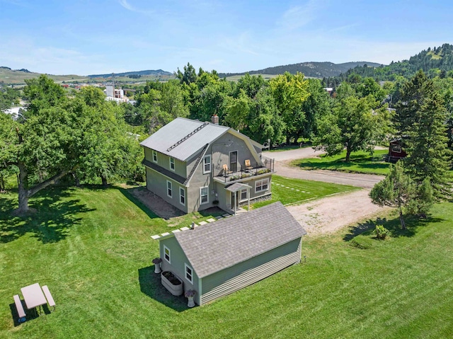 birds eye view of property featuring a mountain view