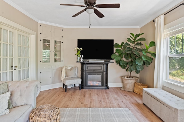 sitting room featuring plenty of natural light, ceiling fan, and light hardwood / wood-style flooring