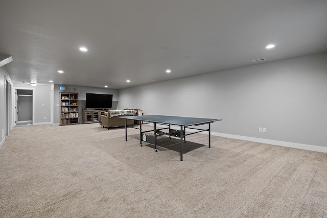 game room with light carpet